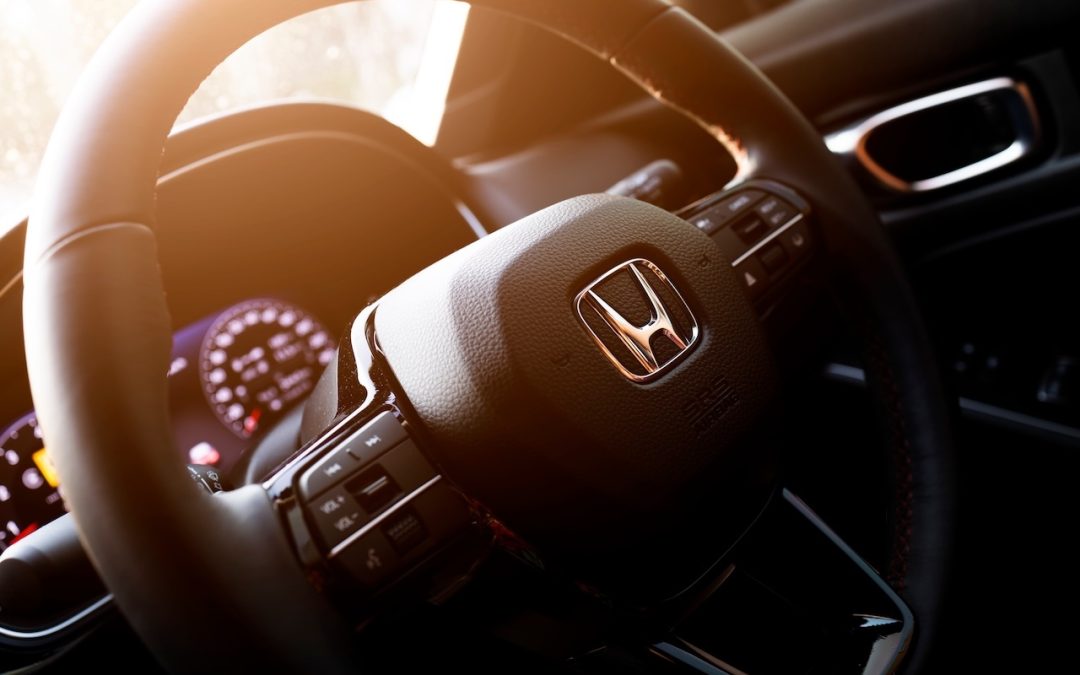 Honda logo on a black steering wheel