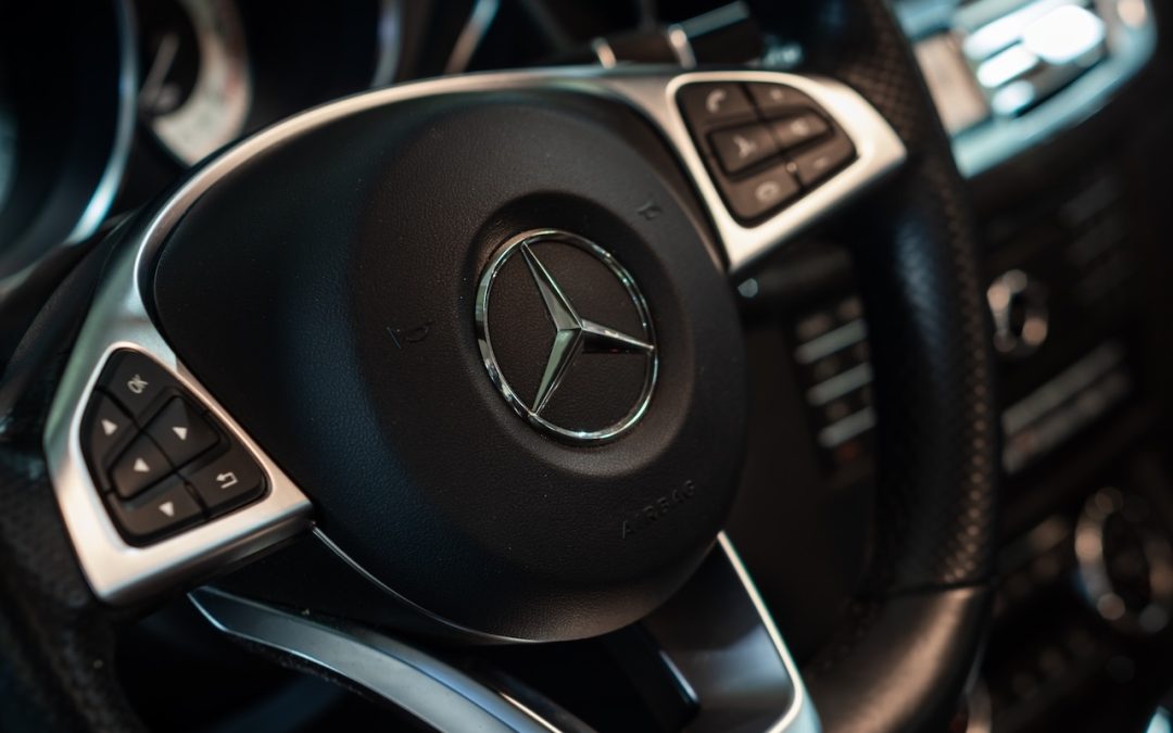 Mercedes-Benz logo on a black steering wheel
